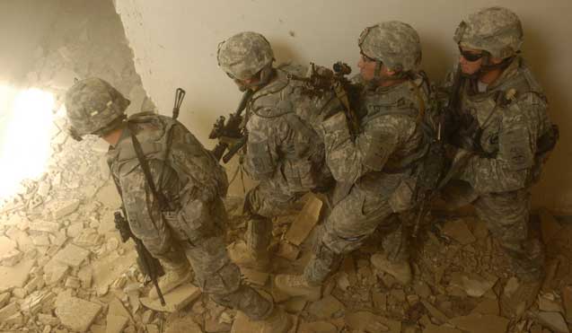 U.S. Soldiers from Echo Company, 5th Cavalry Regiment, 172nd Infantry Brigade prepare to clear a room in a joint training exercise near Bahbahani, Iraq, on June 4.